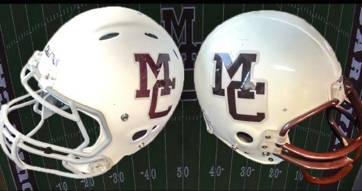 Mount Carmels players will be wearing new helmets (left) for the upcoming season. On the right is an older Mount Carmel helmet. (photo courtesy of Coach Phil Seagroves)