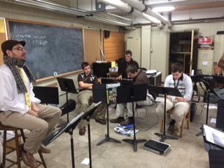 The new band director Moises Pacheco (left) is teaching his class 