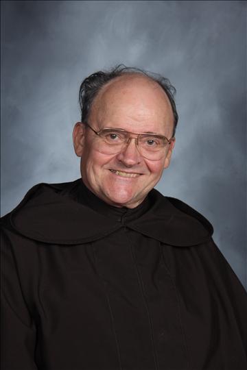 Father Leopold Glueckert, OCarm, brings a wealth of educational experiences as he returns to the school he attended as a freshman.
