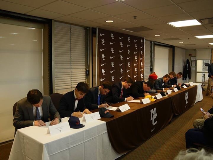 Nine Caravan athletes signing letters of intent on 11/15.