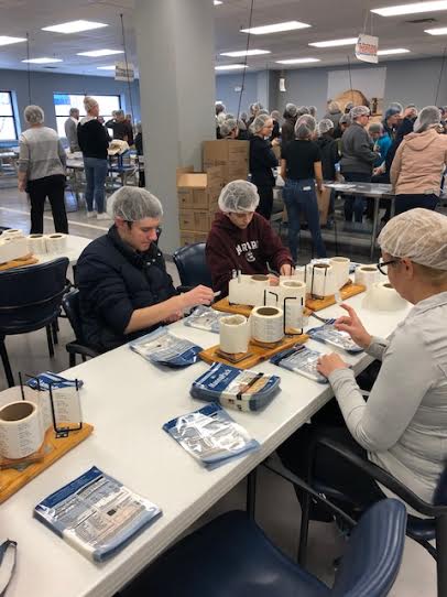 At the end of the day at Feed My Starving Children, one group of MC students had packed 194 boxes of food for developing nations.