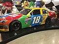 Kyle Buschs colorful #18 car is a familiar sight on the Nascar circuit.
(Photo Credit via Wikimedia Commons under Creative Commons license)