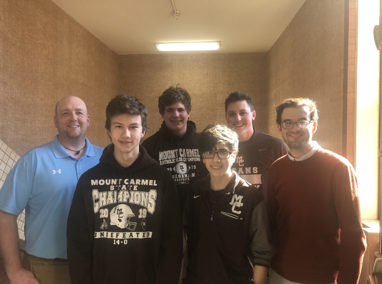 There are nine current or prospective Eagle Scouts at Mount Carmel:  (left to right) Mr. Jim Peltzer, Joe Baranowski 22, Noah Sanchez 22, Mr. Dominic Scheuring, Brad Uzubell 23, and Alexander Uzubell 21. (Not pictured: Zachary Beaver, Mr. John Stimler and Mr. Stephen Lilly).