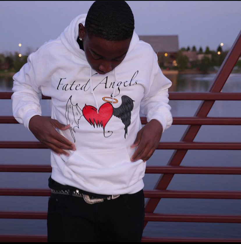 Kendrick rocks one of his custom hoodies from his “Fated Angels” brand