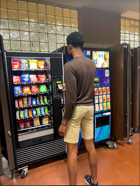 Senior Blayr Young purchasing a snack from the new vending machine on May 4. 