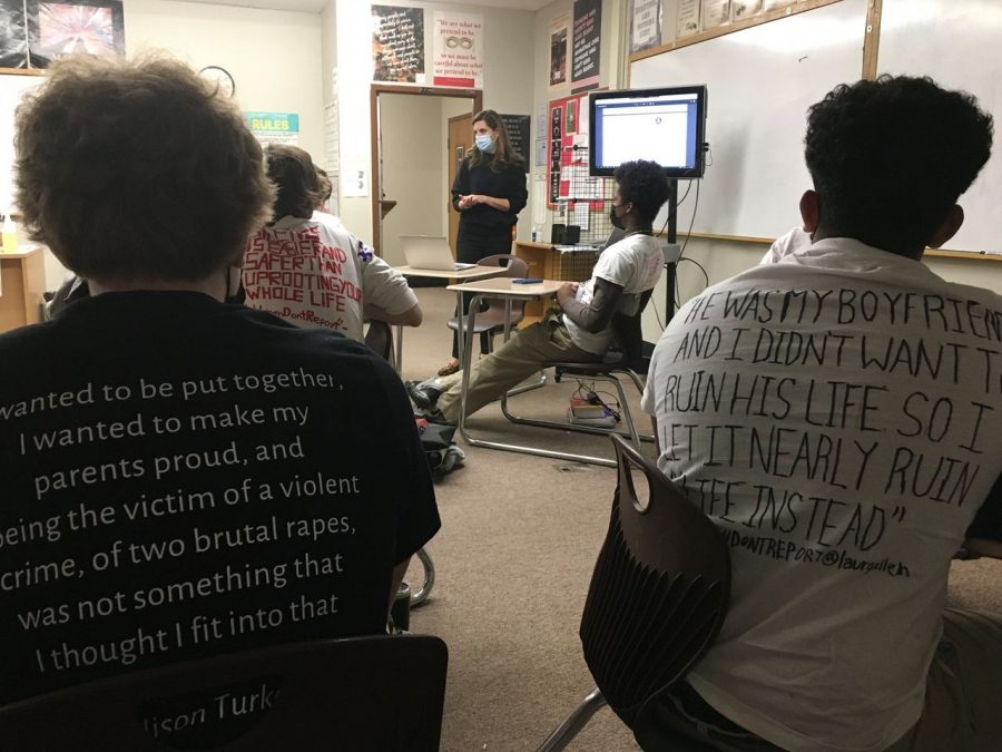 MC sophomores listen to the Mrs. Ferro-Lusks presentation on domestic and teen dating violence while wearing self-created shirts.