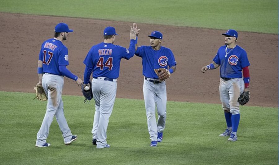 The 2016 Chicago Cubs infield celebrates a win. (left to right: Kris Bryant, Anthony Rizzo, Addison Russell, and Javier Baéz. (photo via Wikimedia Commons under Creative Commons license)