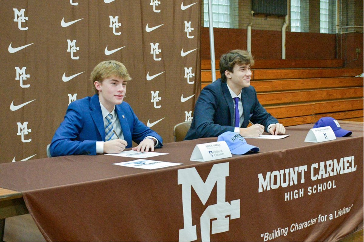 Seniors Aiden Gawel (left) and Angelo Ciaravino signed their national letters of intent in the Alumni gym on the morning of November 8th. 