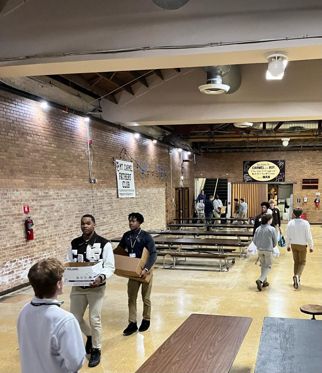 MC students help prepare the donated food drive items for delivery to the Maple Morgan Park Food Pantry.