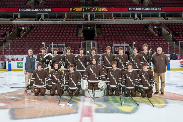 Varsity proudly lines up at center ice after winning at the United Center against the Tigers from Saint Xavier on January 13, 2024.

