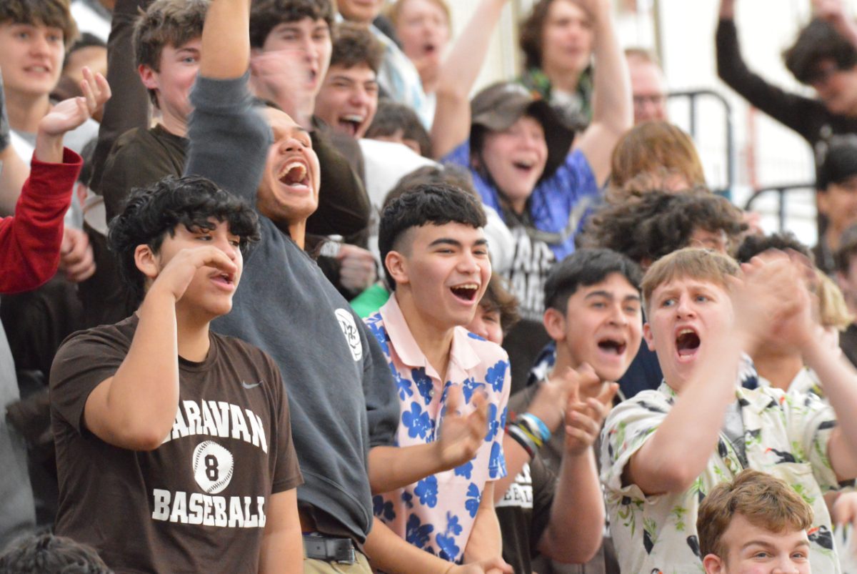 Students cheer on their classmates during a Spirit Week activity. Mount Carmel has introduced several unique features to cater towards the male brain and work around events such as this one. The trimester schedule happens to be one of them. 
