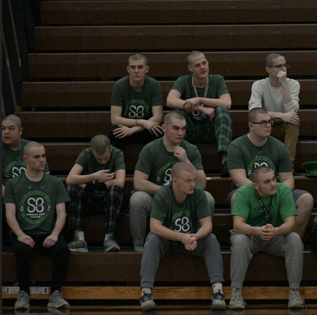 MC shavees raised money to fight childhood cancer before getting their heads shaved in front of the school.