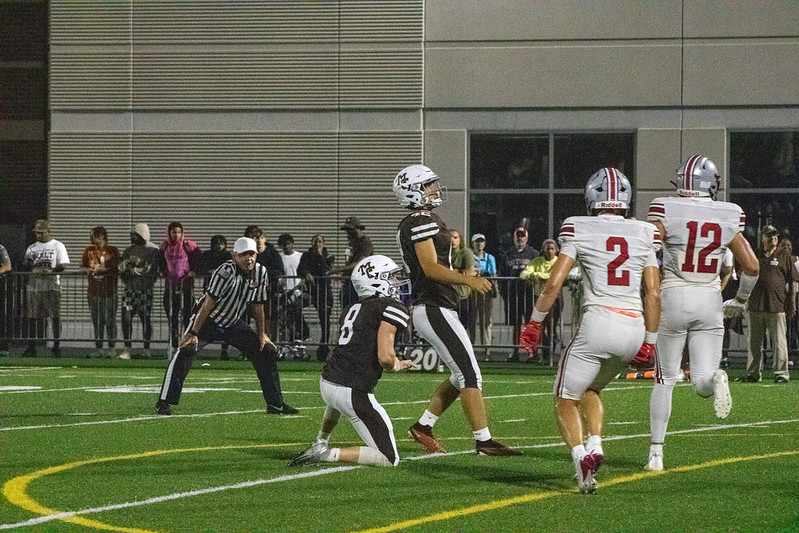 Nico Mullen (standing) kicks an extra point against the Hun Academy on August 29, 2024.