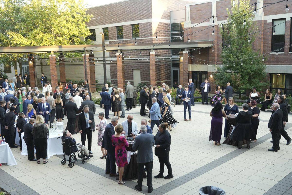 Alumni and guests gather in the huddle during the Gala on September 21, 2024. 
