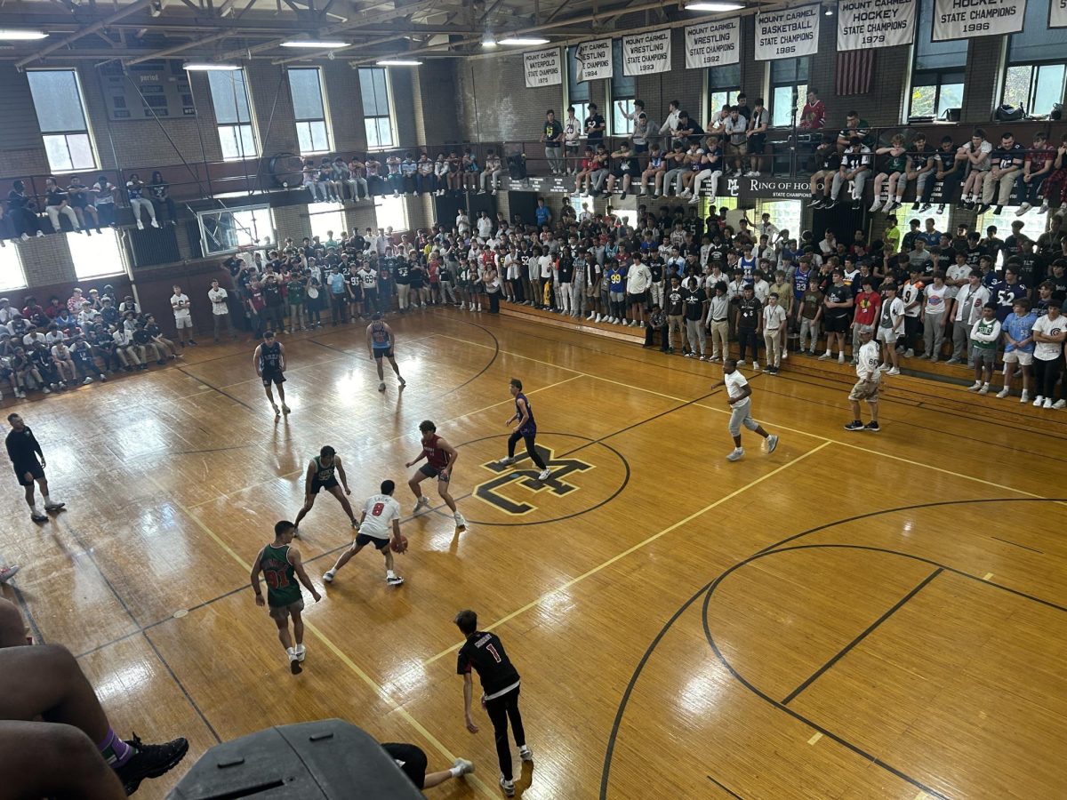 Basketball in the Alumni Gym between the classes and faculty team is a staple of Spirit Week.