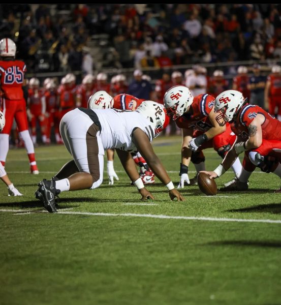 Caleb Tucker lines up against the St. Rita Mustangs’ offense in their matchup during the second week of the regular season. Tucker and his defensive teammates led the Caravan to their first and only shutout so far this year. 
