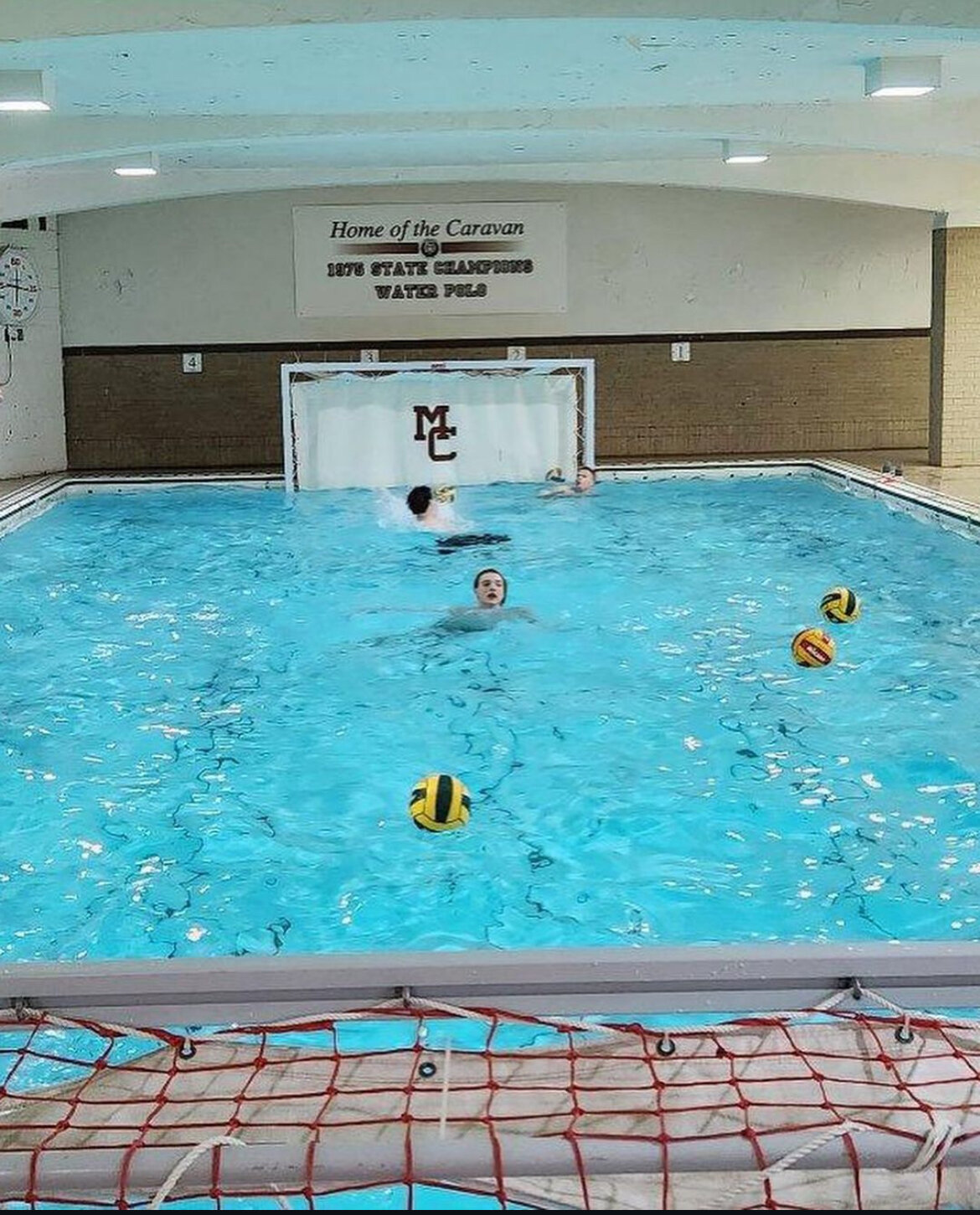 McCluer treads water in the middle of the Mount Carmel swimming pool during a practice.
