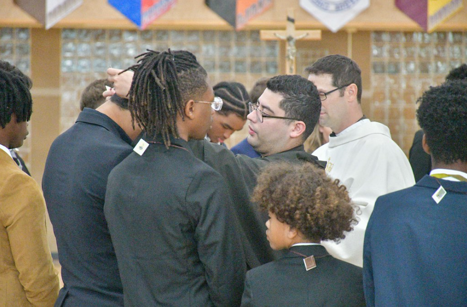 Freshman and transfer students receive their scapulars at the all school liturgy for the Feast of east of St. Therese of Lisieux on October 1. 2024. 