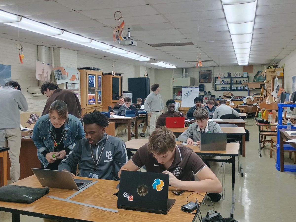 Mrs. Julie Chappetto (left) works with students in her Advanced Art Studio 2 class.