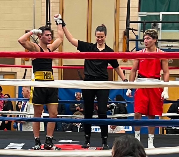 Mariano Sandoval (left) won his match at the Illinois Silver Gloves tournament on December 3rd.