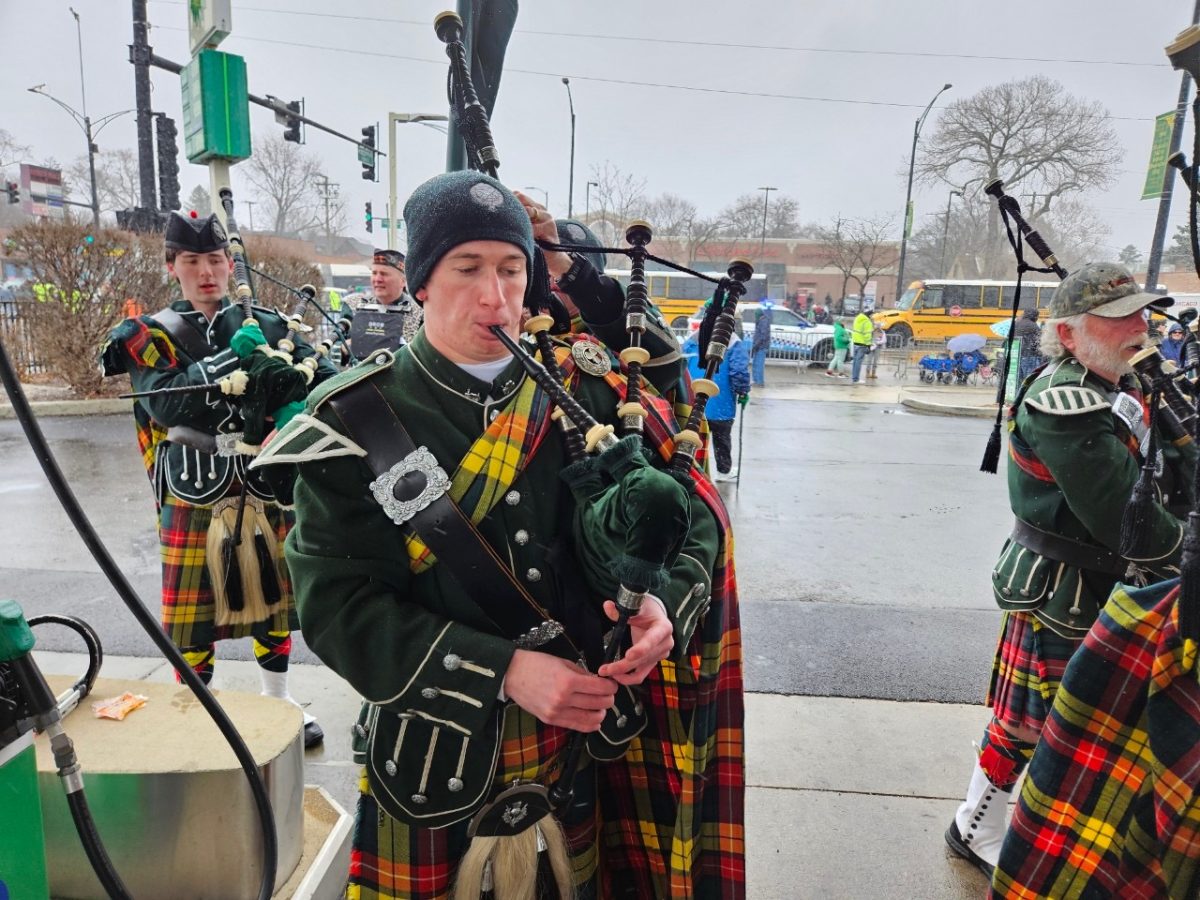 Senior Marty Mann warms up on a snowy morning Sunday, March 16, 2025, for the South Side Irish Parade. Mann lives in Beverly and had plenty of friends and family to support him along the way.

