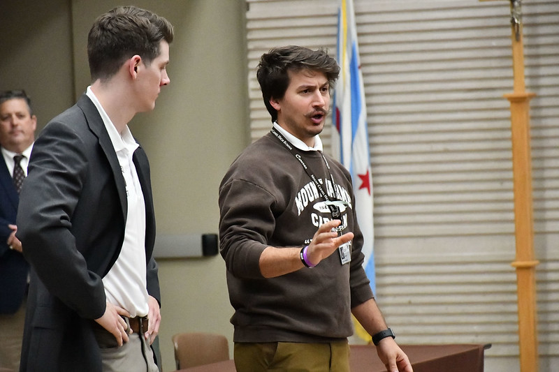 AP English teachers Mr. Dan Haggerty (left) and Mr. Brooks Nevrly inform incoming freshmen and their families about the AP curriculum at the Honors Program Preview on November 7, 2024.