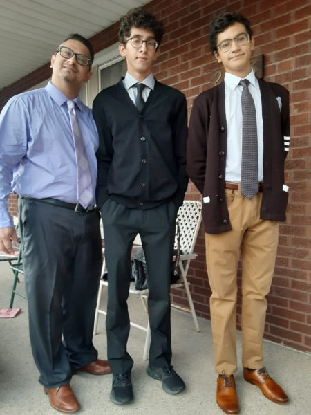 (From left) My father Manuel Mancilla, my brother Rocco Mancilla ’22, and me with my iconic cardigan dressed up for my freshman year Father Son Dinner.