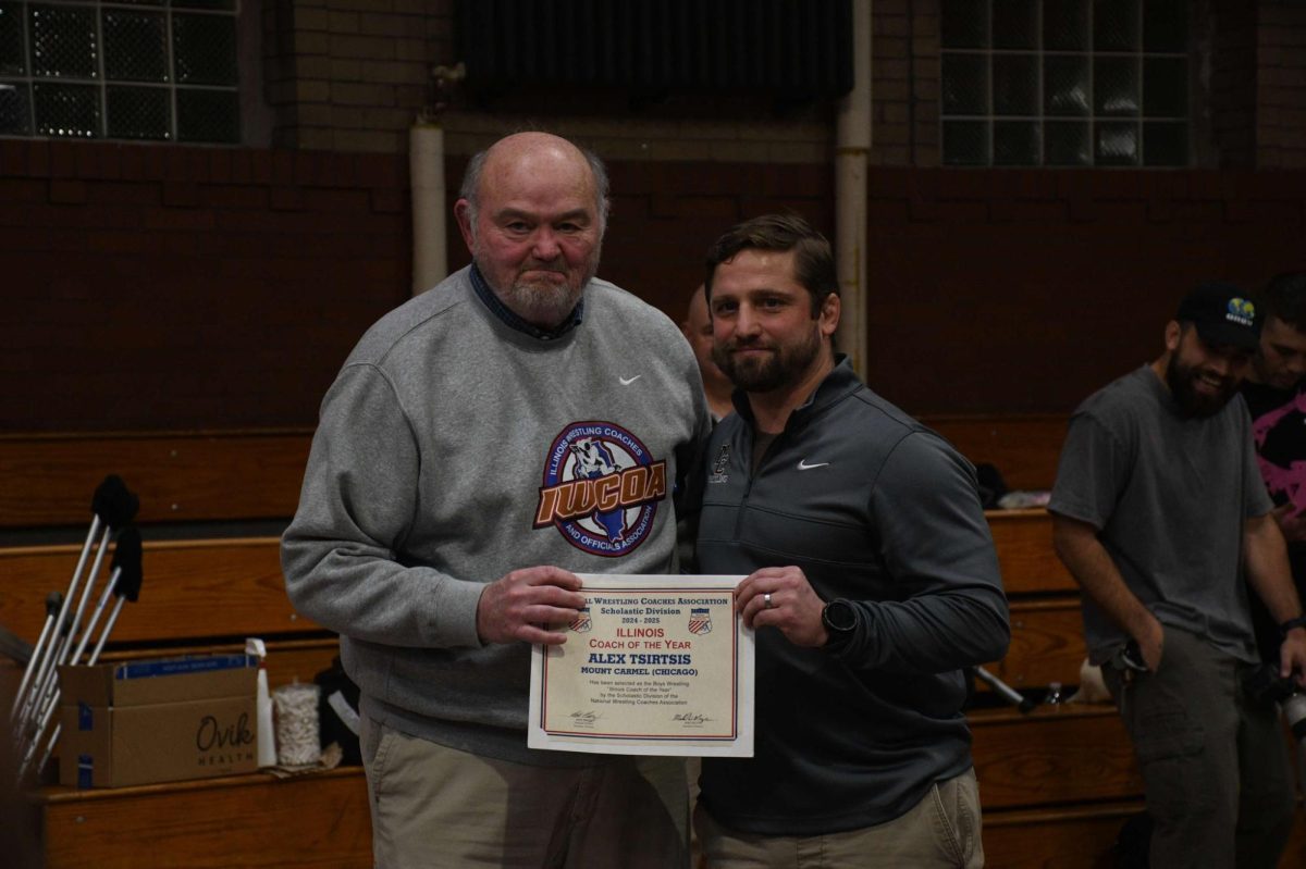 Coach Tsisrtis receives his award on January 16th, 2026, before a match vs. Crown Point.