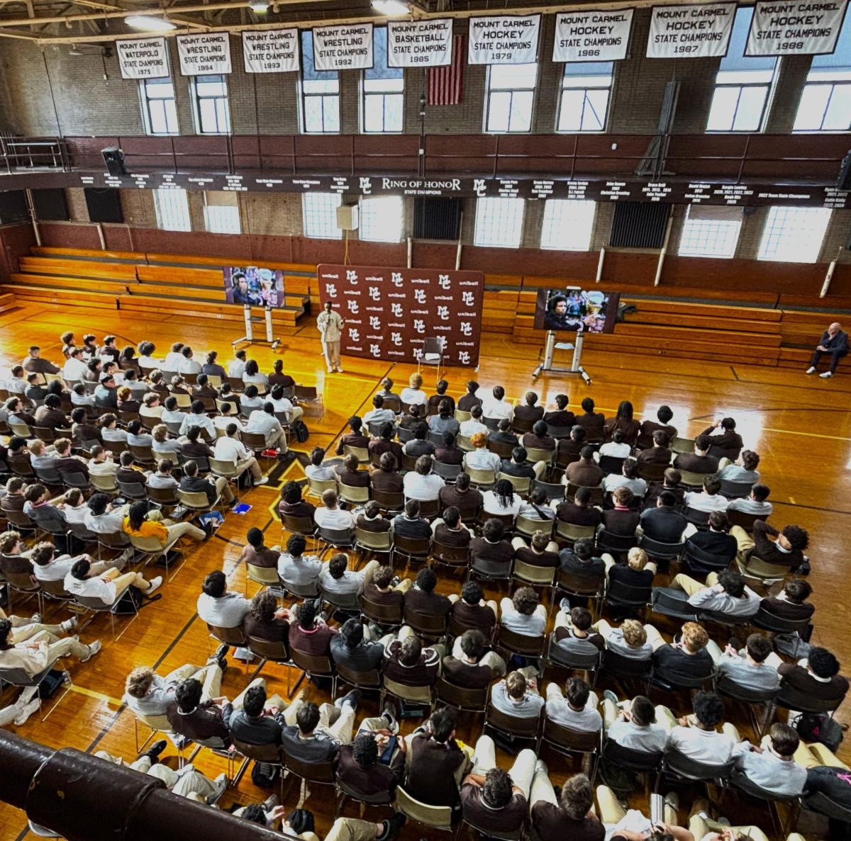 Sports journalist and author Scoop Jackson addressed students during Mount Carmel's Martin Luther King Jr. assembly in the Alumni Gym on January 20 and 22, 2026.