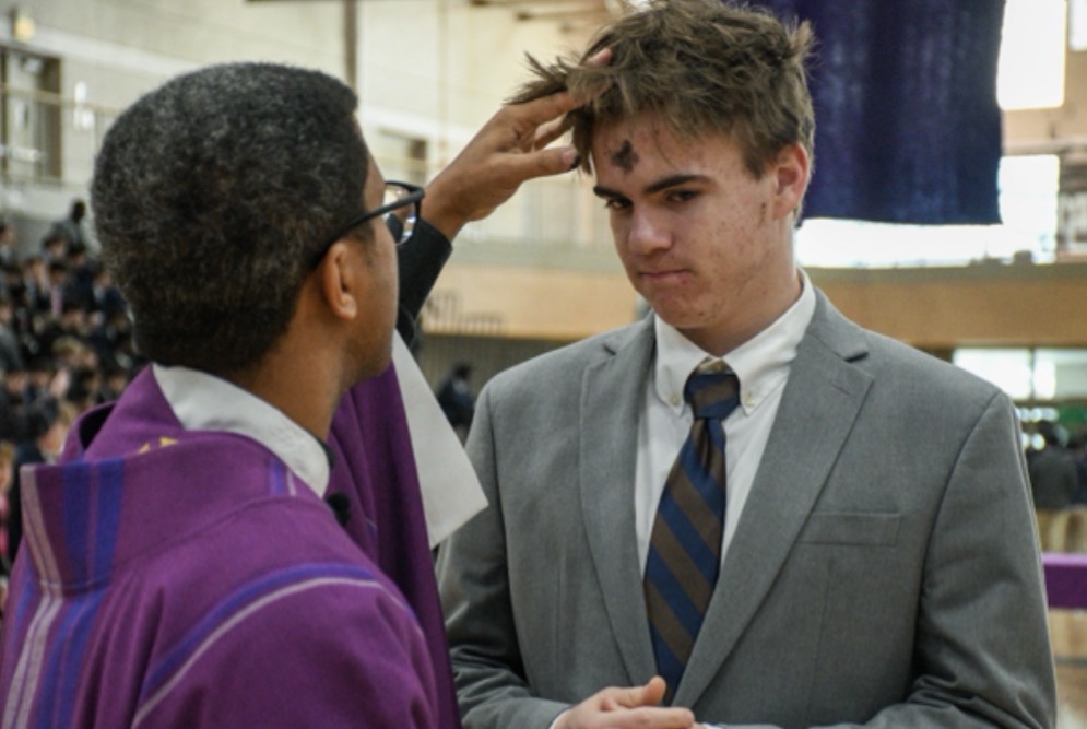 MC junior Marty Fiske gets ashes at an all-school mass on February 18. 2026.
