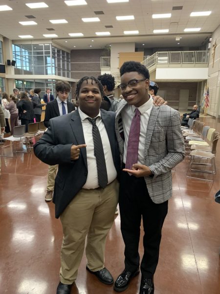 Jeremy Ingram (left) and Aaron Hyler celebrate after being inducted into NHS. 