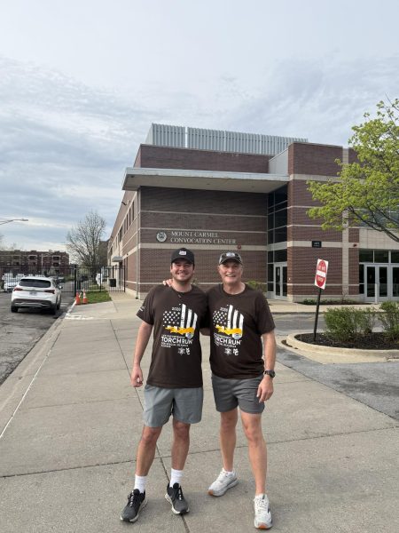 Richard O’Brien (right) and his son, Marty, at the MC torch run. 
