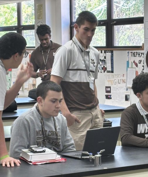 (From left) Juniors Nicholas Lodato, Connor Martin, and Mihailo Popovic working during Mr. Collier's AP Physics class.